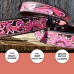 A set of intricately designed pink and black leather belts featuring floral patterns. The image highlights features in three circular icons at the bottom: "Full Grain Leather," "No Rust Resistant," and "Secure Buckle Closure." These designs are reminiscent of our popular Leather Dog Collar- Pink Painted Sunflower- Tooled.