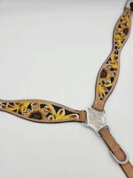 A decorative leather horse breast collar with hand-tooled sunflower designs in yellow and green against a black background, featuring intricate silver hardware. The collar is laid out on a plain white surface.