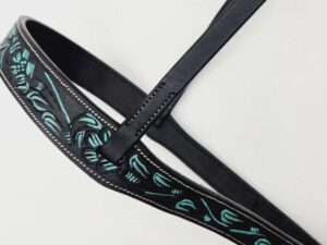 Black leather belt with intricate blue and light blue embroidered designs. The belt features neatly stitched borders and appears to have a buckle for fastening. It is displayed on a white background.