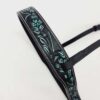 A black leather strap with intricate embossed floral designs in teal and green accents. The strap has stitching along the edges and a buckle for adjustment. The background is plain white.