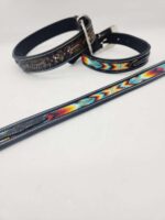 Two black leather belts and one colorful woven belt are depicted against a plain white background. One leather belt features an engraved design, while the other has a detailed, colorful pattern stitched on it. The woven belt has vibrant colors in a diagonal pattern.