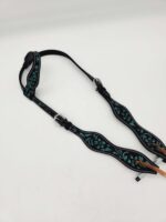 A black and turquoise embroidered dog collar and leash set with a floral pattern. The collar is adjustable with a silver buckle, and the leash features a soft, comfortable handle, also adorned with the same intricate embroidery. Both lay flat against a white background.