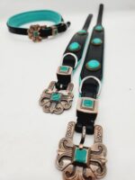 A black leather belt set with ornate silver buckles and turquoise gemstone inlays. The Leather Dog Collar- Natural Turquoise Stone, reminiscent of a stylish turquoise dog collar, includes two long belts and one shorter belt with matching design elements. The turquoise accents are prominent against the dark leather.