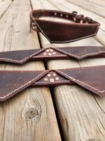 Elegant leather dog collar with bow tie design and paw print detail, perfect for a stylish and sophisticated pup (1)