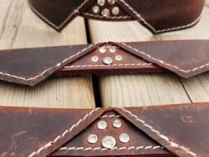 Elegant leather dog collar with bow tie design and paw print detail, perfect for a stylish and sophisticated pup (10)