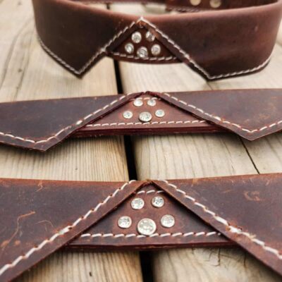 Elegant leather dog collar with bow tie design and paw print detail, perfect for a stylish and sophisticated pup (10)